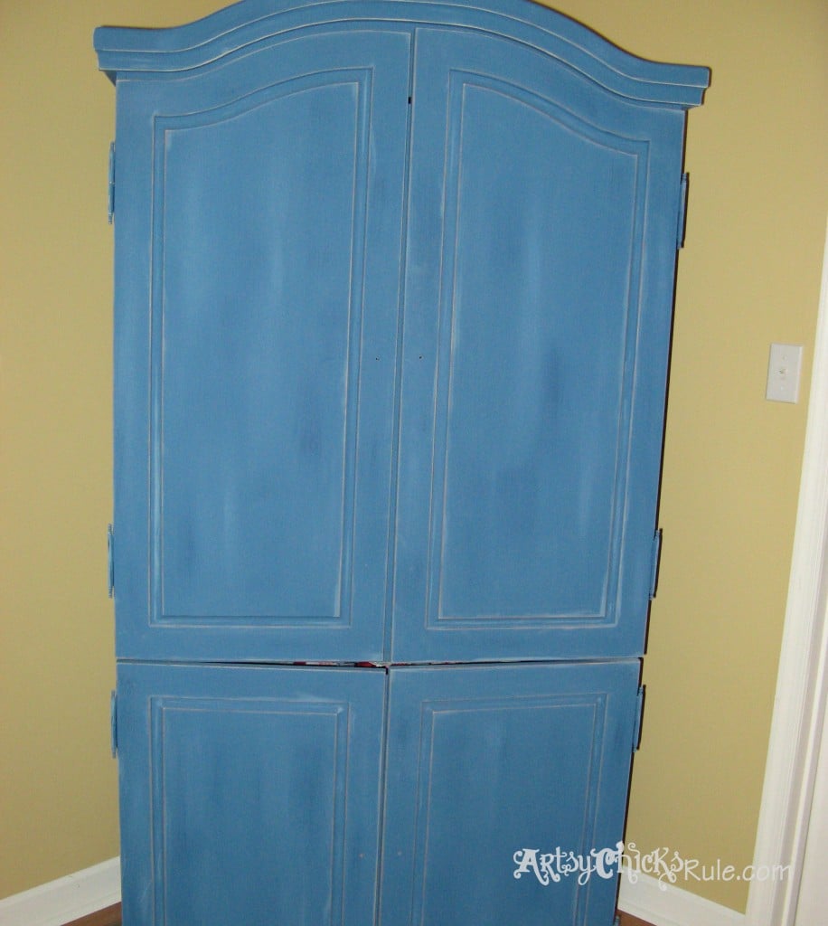 blue armoire with sanded edges to distress