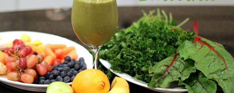 A glass of green smoothie sits beside a plate of leafy greens and assorted fruits like grapes, blueberries, cantaloupe, banana, and pear. The text Green Smoothie appears at the top—perfect inspiration for your favorite green smoothies recipes.