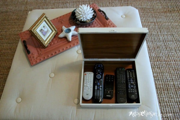 tufted coffee table with box and remotes