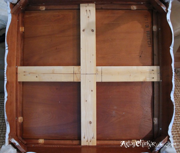 underneath of coffee table showing cross bars and wood top