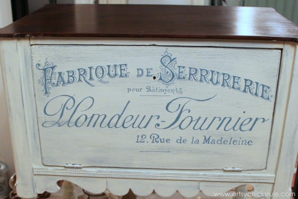 front of cabinet painted with french blue lettering