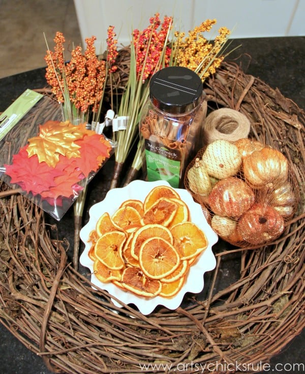 orange colored decor and brown wreath for fall