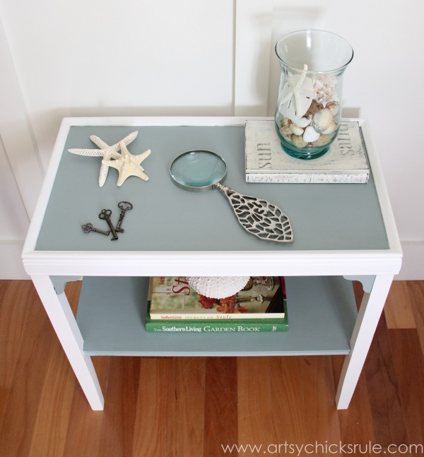 blue and white side table decorated with coastal finds