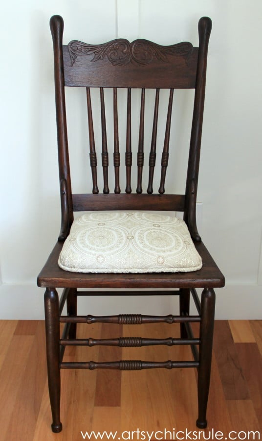 dark stained antique chair and fabric covered seat