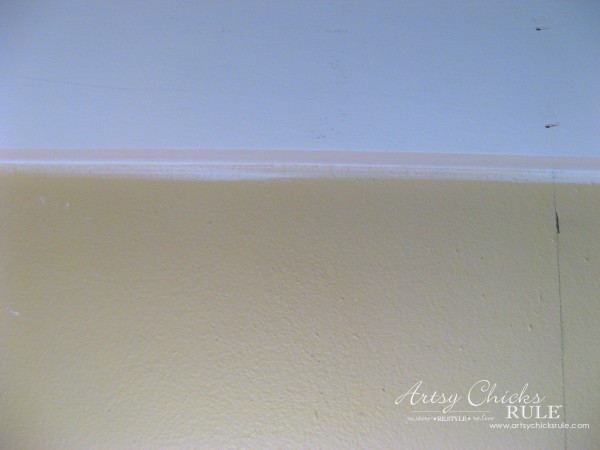 yello wall with white board caulked