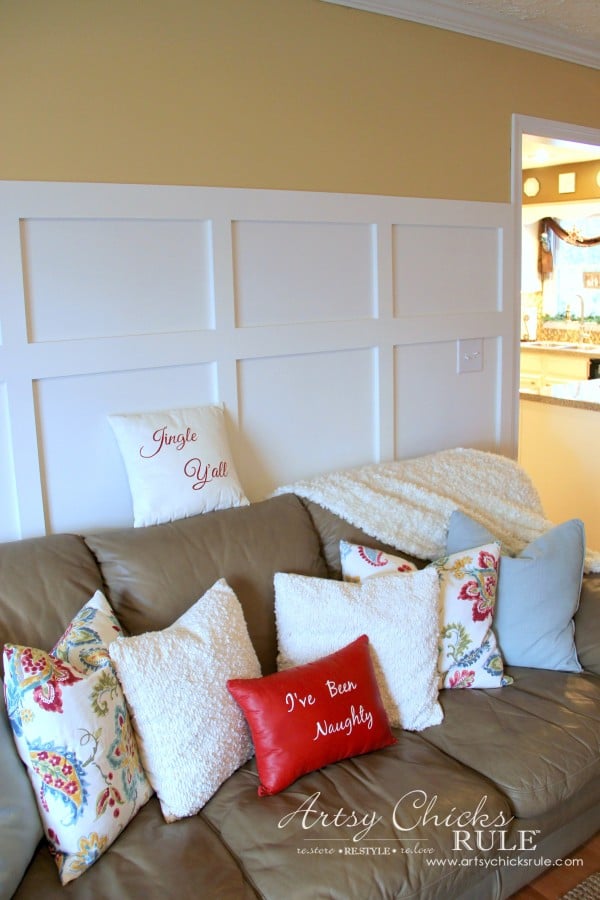 white board and batten with yellow wall and tan couch