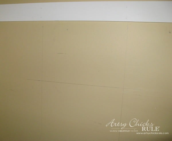 yellow wall with marks from measuring