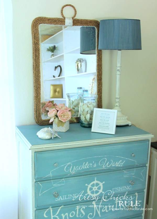 mirror on blue dresser