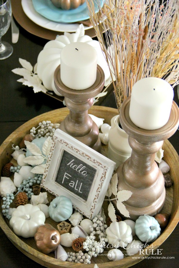 dining table center piece with fall decor and small pumpkins