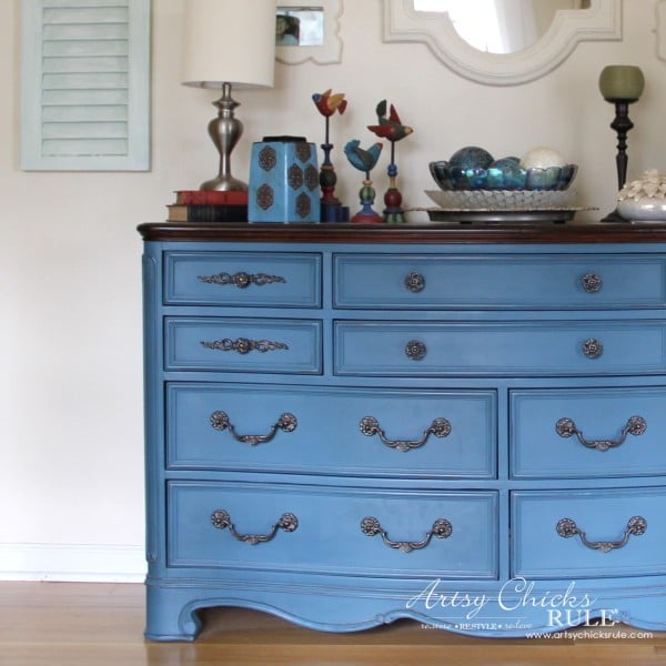 denim blue dresser with decor on top