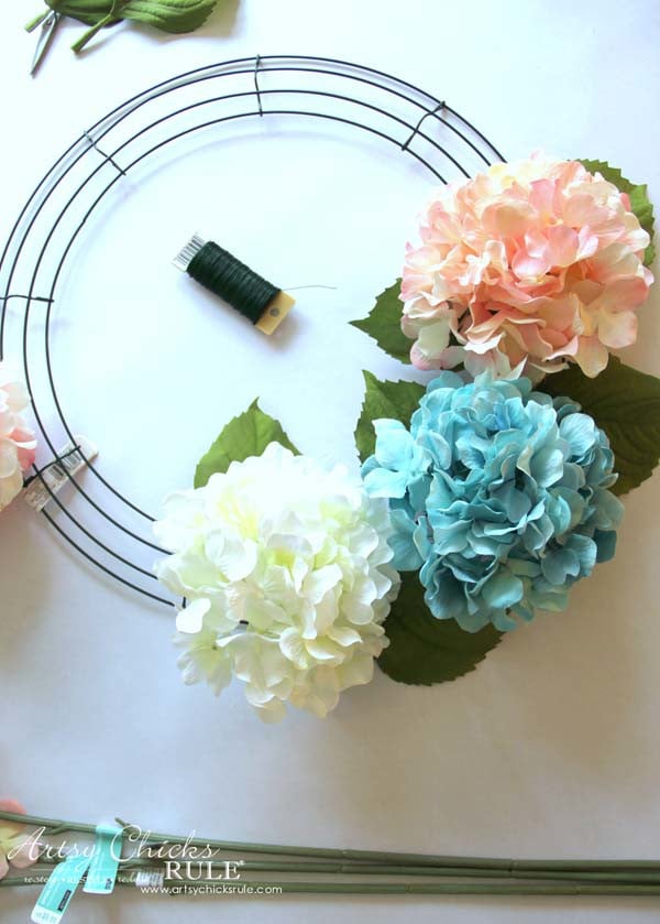 pink blue and white hydrangeas attaching to wire wreath