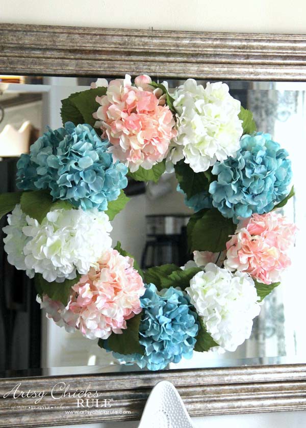 pink blue and white hydrangea wreath on mirror