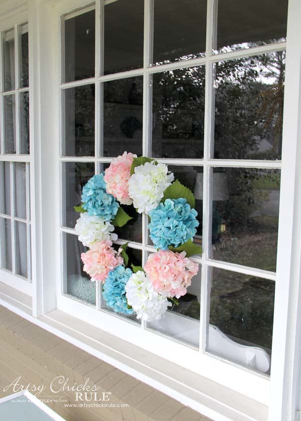 hydrangea wreath hanging on window