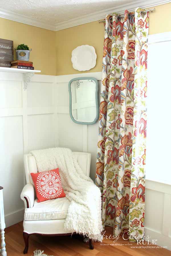 colorful curtains white chair yellow wall