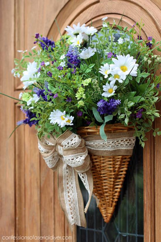 A wildflower basket hanging on the door.