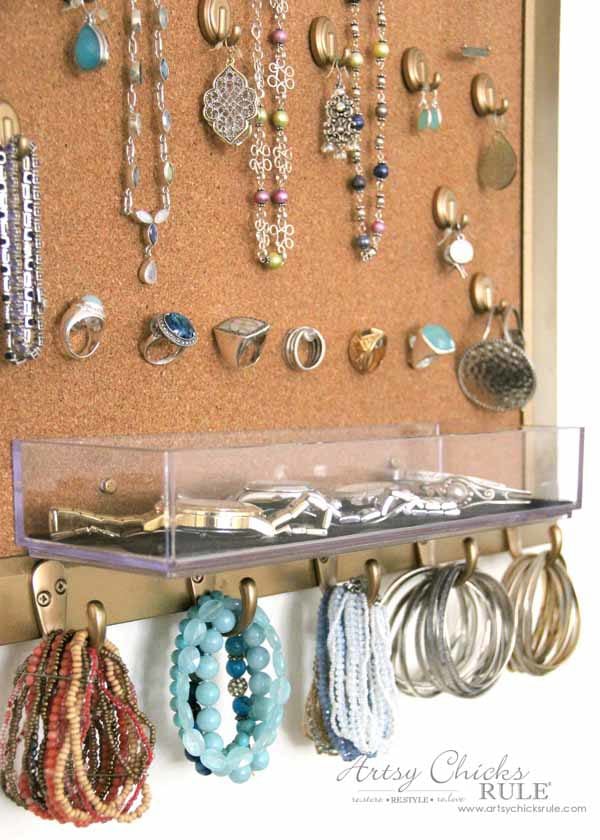 jewelry hanging on corkboard