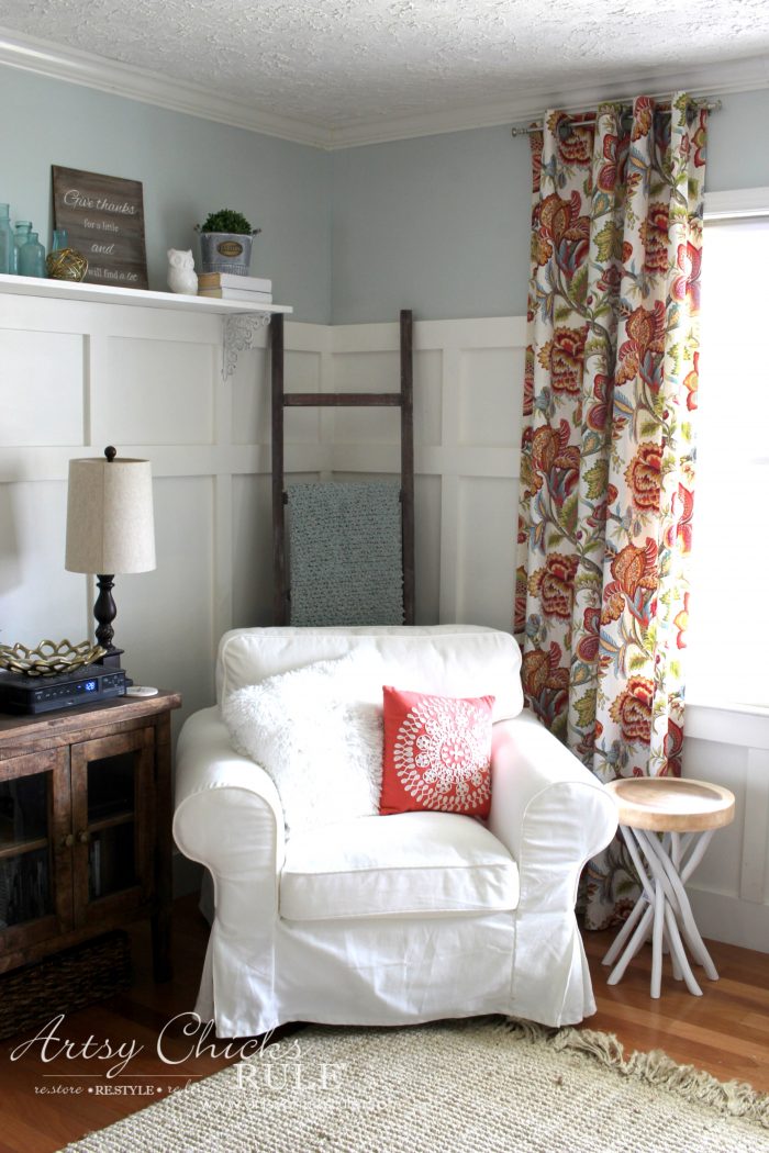 white chair with colorful curtain and ladder