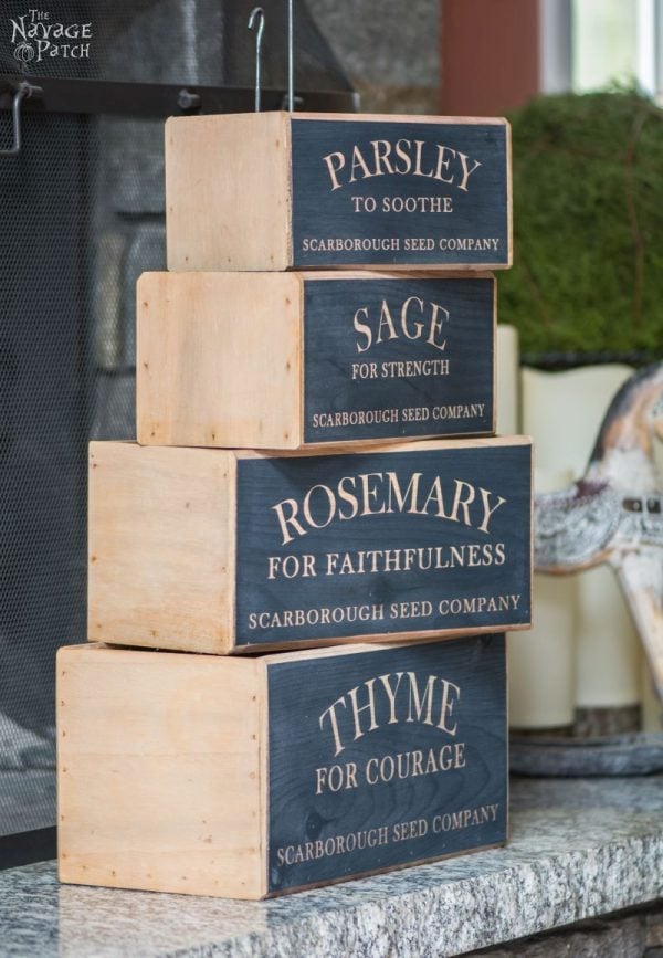 Wooden herb boxes stacked up on top of each other.