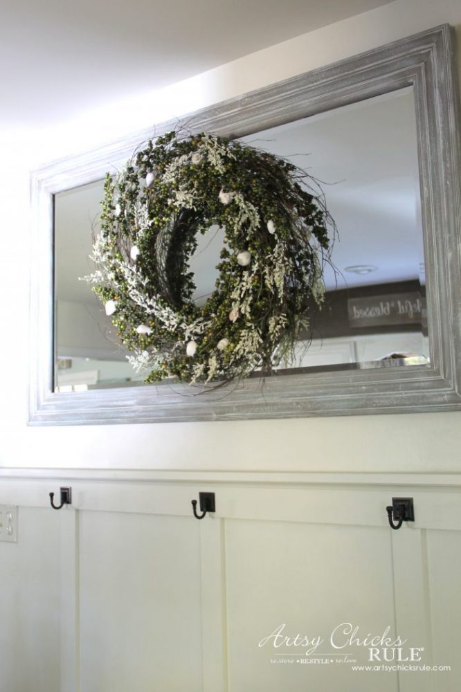 wreath hanging on mirror in kitchen