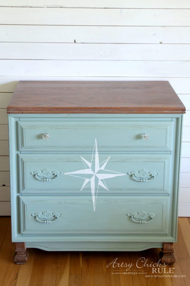 small white chest with blue paint and white compass rose and wood top