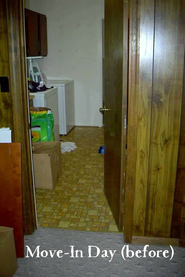 70's vintage laundry room with gold and orange vinyl flooring, wood paneled walls 