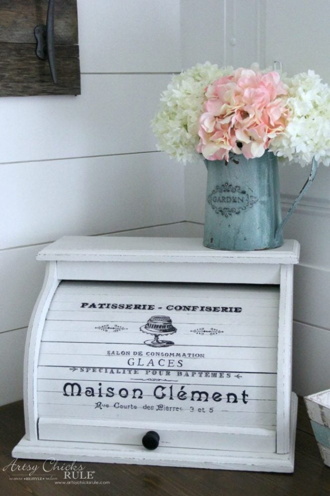 painted white bread box with flowers on top