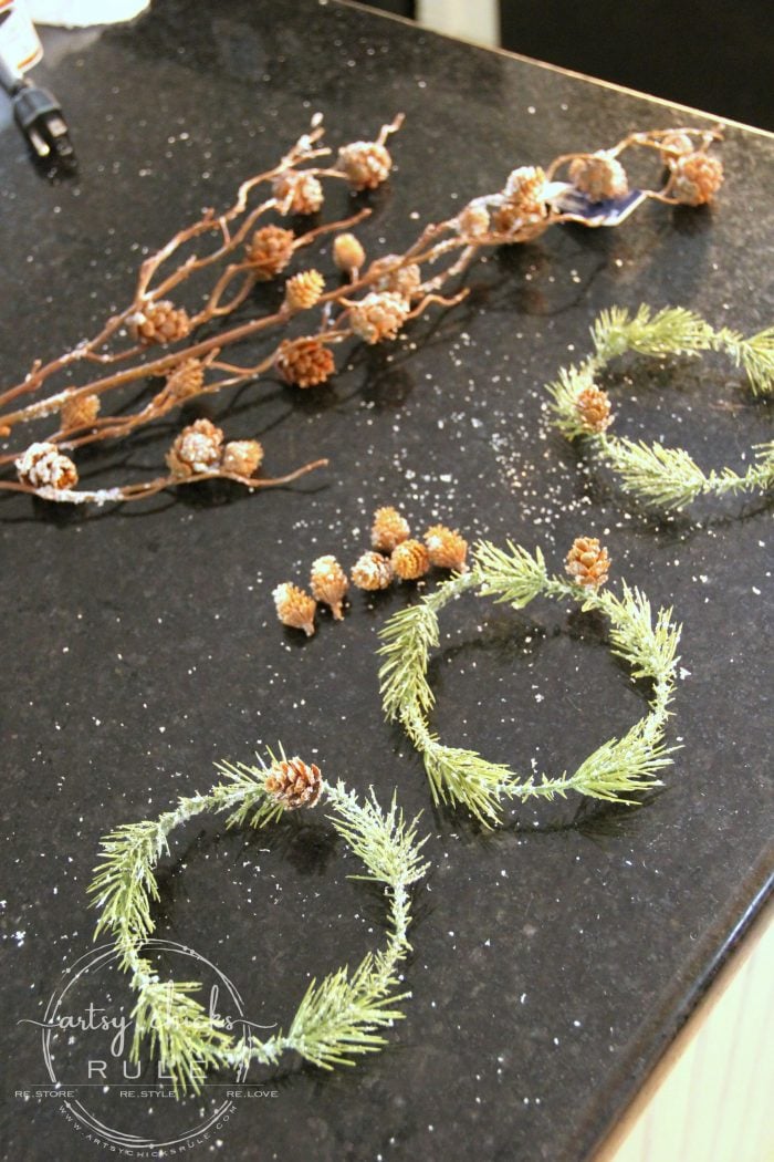These wispy little DIY mini wreaths are so easy to make! And budget friendly too! artsychicksrule.com #miniwreaths #diywreaths #christmaswreaths #diyminiwreaths