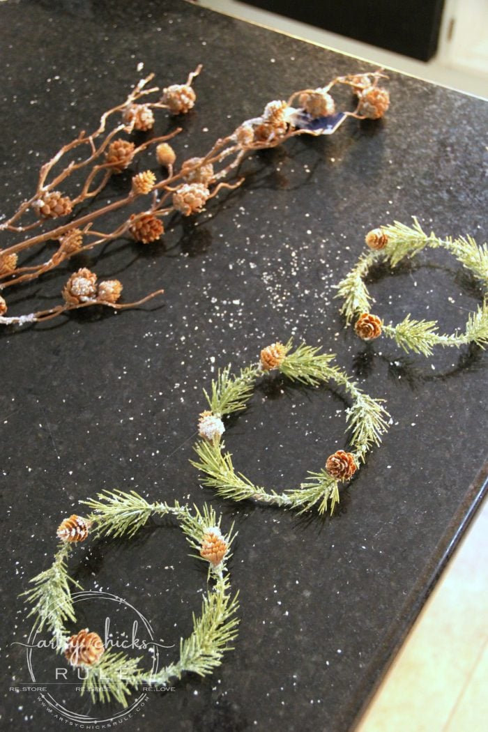 These wispy little DIY mini wreaths are so easy to make! And budget friendly too! artsychicksrule.com #miniwreaths #diywreaths #christmaswreaths #diyminiwreaths