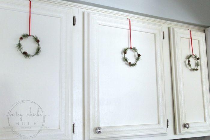 These wispy little DIY mini wreaths are so easy to make! And budget friendly too! artsychicksrule.com #miniwreaths #diywreaths #christmaswreaths #diyminiwreaths