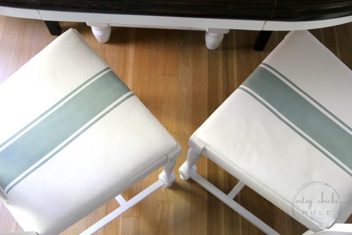 white chair seats with green grain sack stripes