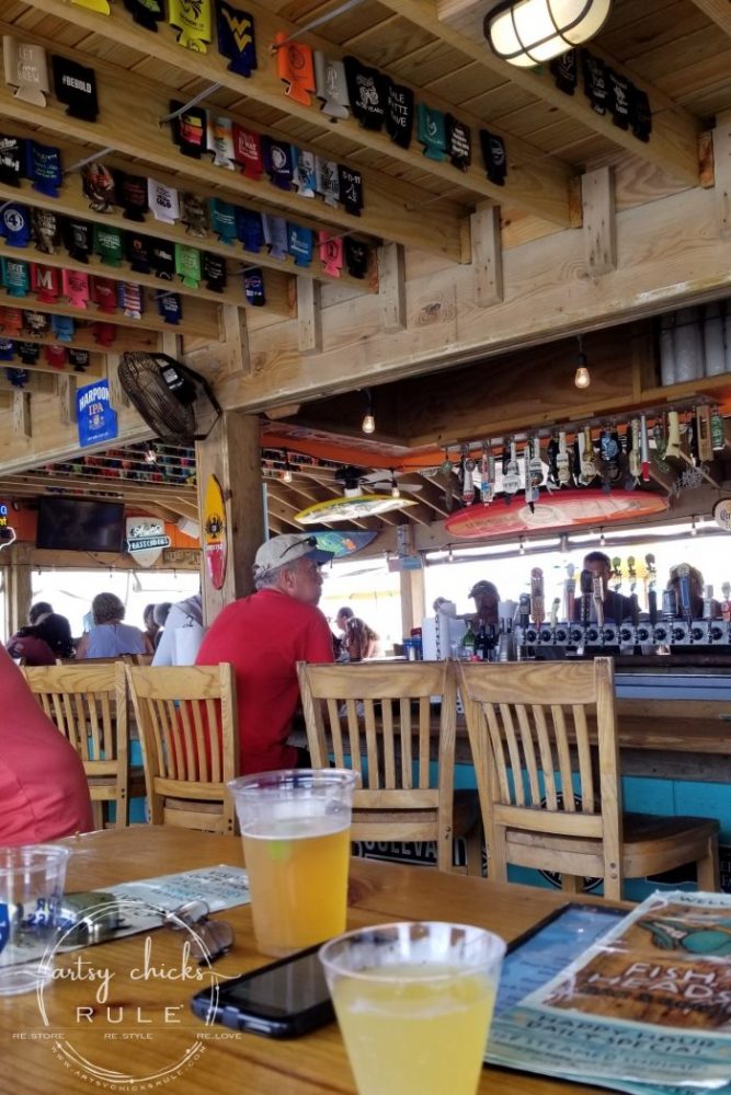 Outer Banks Places To Eat (and shop!) Fish Head's Bar- artsychicksrule.com #outerbanks #outerbankseats #outerbanksshopping #beachdecor #coastalstyle #traveldestinations #travelideas #obx #beachtrips #coastaldestinations