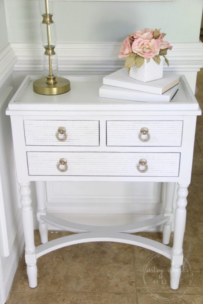 white painted table with gold pulls