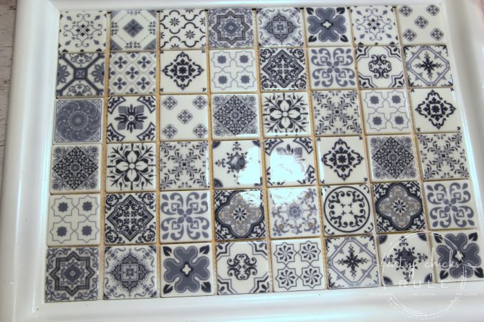 DIY Navy Blue and White Tile Tray....From Thrift Store Find! (add grout) artsychicksrule.com #blueandwhitetile #blueandwhitedecor #tileideas #thriftymakeover #trashtotreasure #blueandwhite #blueandwhitepillows