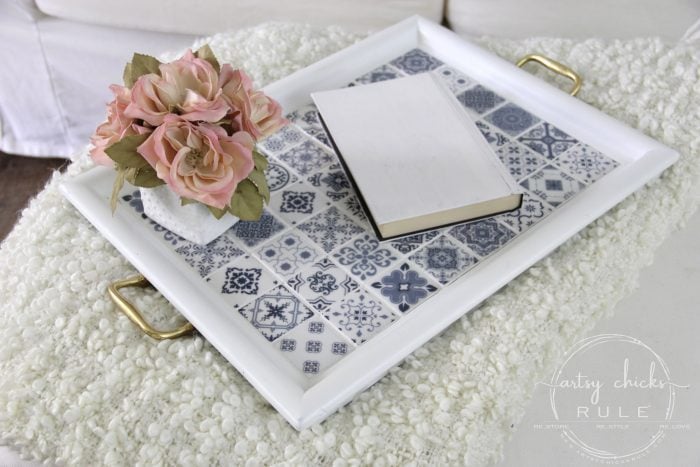 wood frame with gold handles painted white with blue and white tiles inside