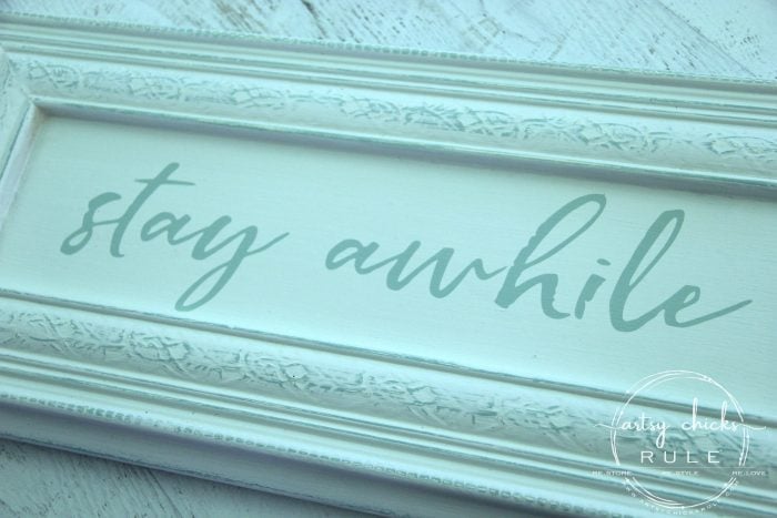 Make Your Own Stay Awhile Sign With This FREE Printable spray paint and done! artsychicksrule.com #repurposed #cabinetdoorideas #stayawhile #diysign #freeprintable #cabinetdoorrepurposed #silhouetteprojects