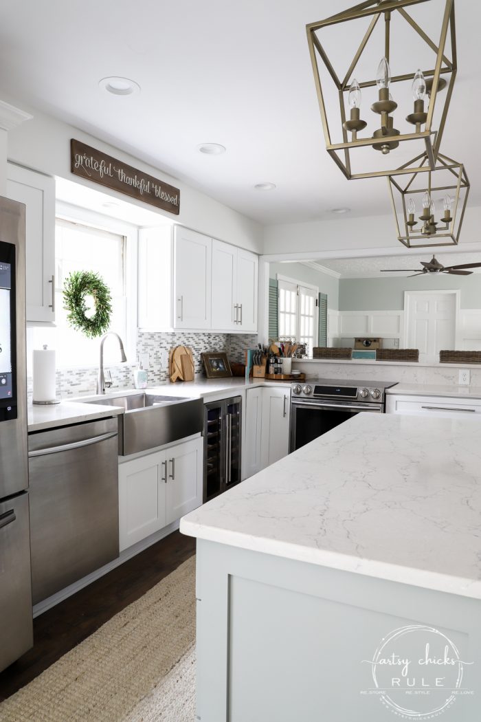 DIY Coastal Kitchen Makeover Reveal!!! White Shaker cabinetd, quartz countertops, farmhouse style flooring and more! artsychicksrule.com #kitchenmakeover #kitchenremodel #diykitchen #coastalkitchen #quartzcountertops #farmhouseflooring