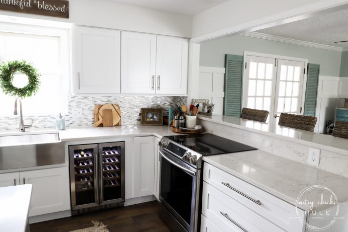 DIY Coastal Kitchen Makeover Reveal!!! White Shaker cabinetd, quartz countertops, farmhouse style flooring and more! artsychicksrule.com #kitchenmakeover #kitchenremodel #diykitchen #coastalkitchen #quartzcountertops #farmhouseflooring