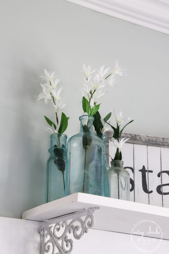 Simple Spring Decorations & Ideas white floral sprigs in antique blue jars artsychicksrule.com