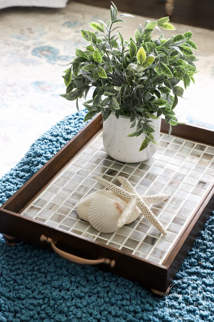 tiled wood tray with handles on each side and knobs for feet