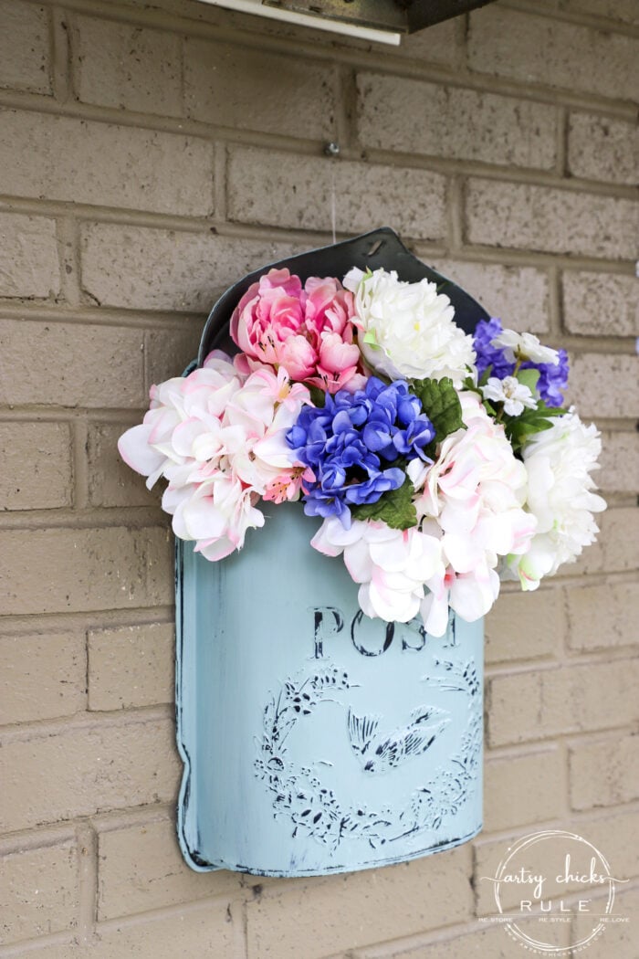 This sweet antique mailbox makes the perfect spot for spring flowers!! Even if it's the wrong color! Just paint it! artsychicksrule.com porch decor