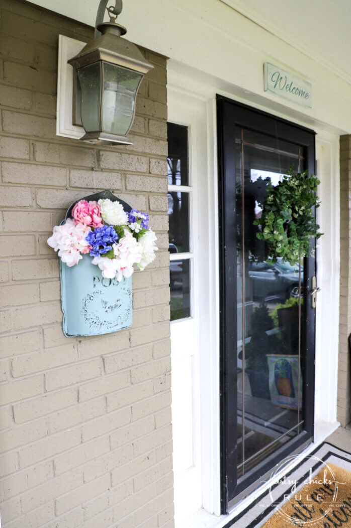 This sweet antique mailbox makes the perfect spot for spring flowers!! Even if it's the wrong color! Just paint it! artsychicksrule.com front door eucalyptus wreath