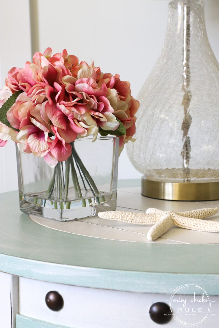 Nautical end table close up with pink flowers artsychicksrule.com