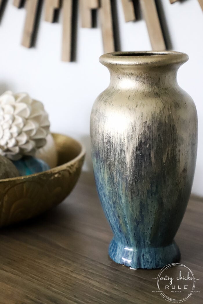 Thrifty find? Not the right color? Add a little paint and make it yours! This painted vase got a brand new look with a dash of gold paint. artsychicksrule.com #paintedvase #goldvase #blueandgold #craftymakeover #budgetdecor