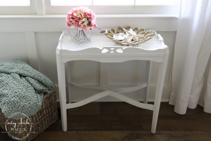 This old thrift store table had a dated tiled top! SO simply updated by painting!! The painted tiles look amazing now! artsychicksrule.com #paintedtile #paintingtiles #chalkpaintedfurniture #paintedfurniture #whitefurniture