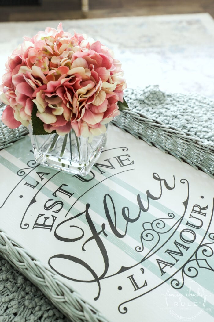 aqua basket tray with white base and black French script