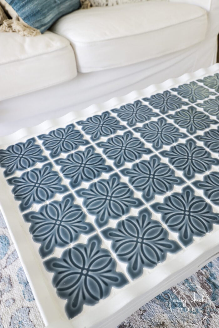 How To Tile A Table Top....easier than you think! Use this simple trick to tile all the things...furniture, decor and more! artsychicksrule.com #howtotile #tileatabletop #blueandwhitetile #furnituremakeover #paintedfurniture