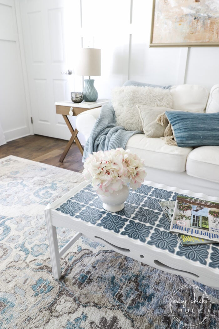 How To Tile A Table Top....easier than you think! Use this simple trick to tile all the things...furniture, decor and more! artsychicksrule.com #howtotile #tileatabletop #blueandwhitetile #furnituremakeover #paintedfurniture