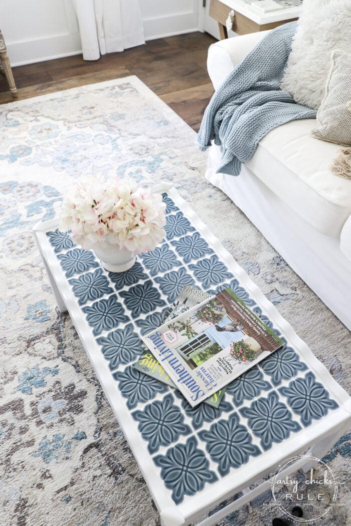 How To Tile A Table Top....easier than you think! Use this simple trick to tile all the things...furniture, decor and more! artsychicksrule.com #howtotile #tileatabletop #blueandwhitetile #furnituremakeover #paintedfurniture