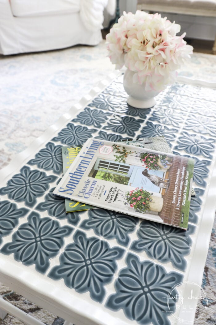 How To Tile A Table Top....easier than you think! Use this simple trick to tile all the things...furniture, decor and more! artsychicksrule.com #howtotile #tileatabletop #blueandwhitetile #furnituremakeover #paintedfurniture