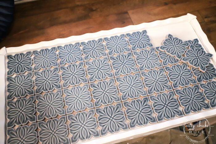 How To Tile A Table Top....easier than you think! Use this simple trick to tile all the things...furniture, decor and more! artsychicksrule.com #howtotile #tileatabletop #blueandwhitetile #furnituremakeover #paintedfurniture